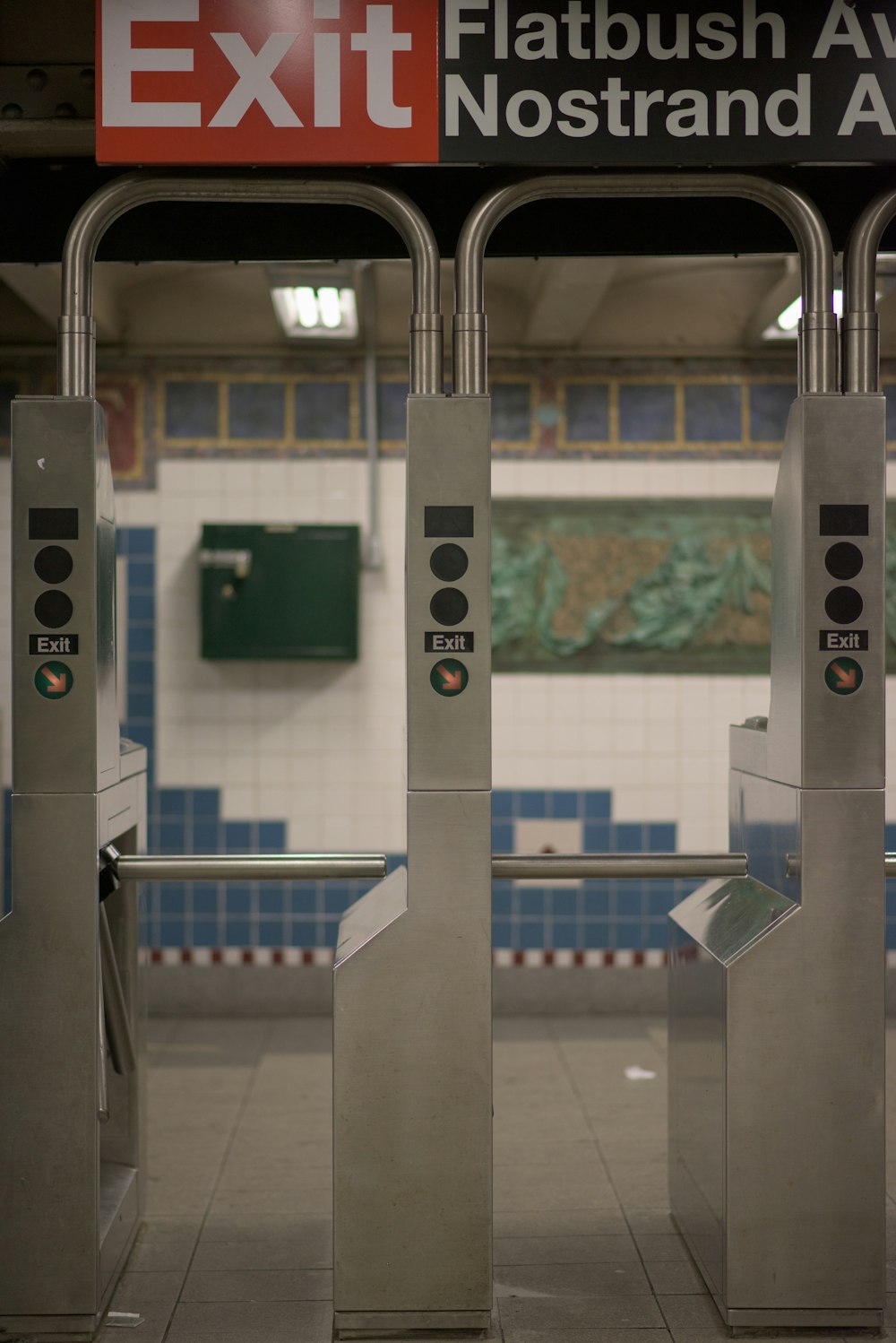 Exit signage on tripod turnstile