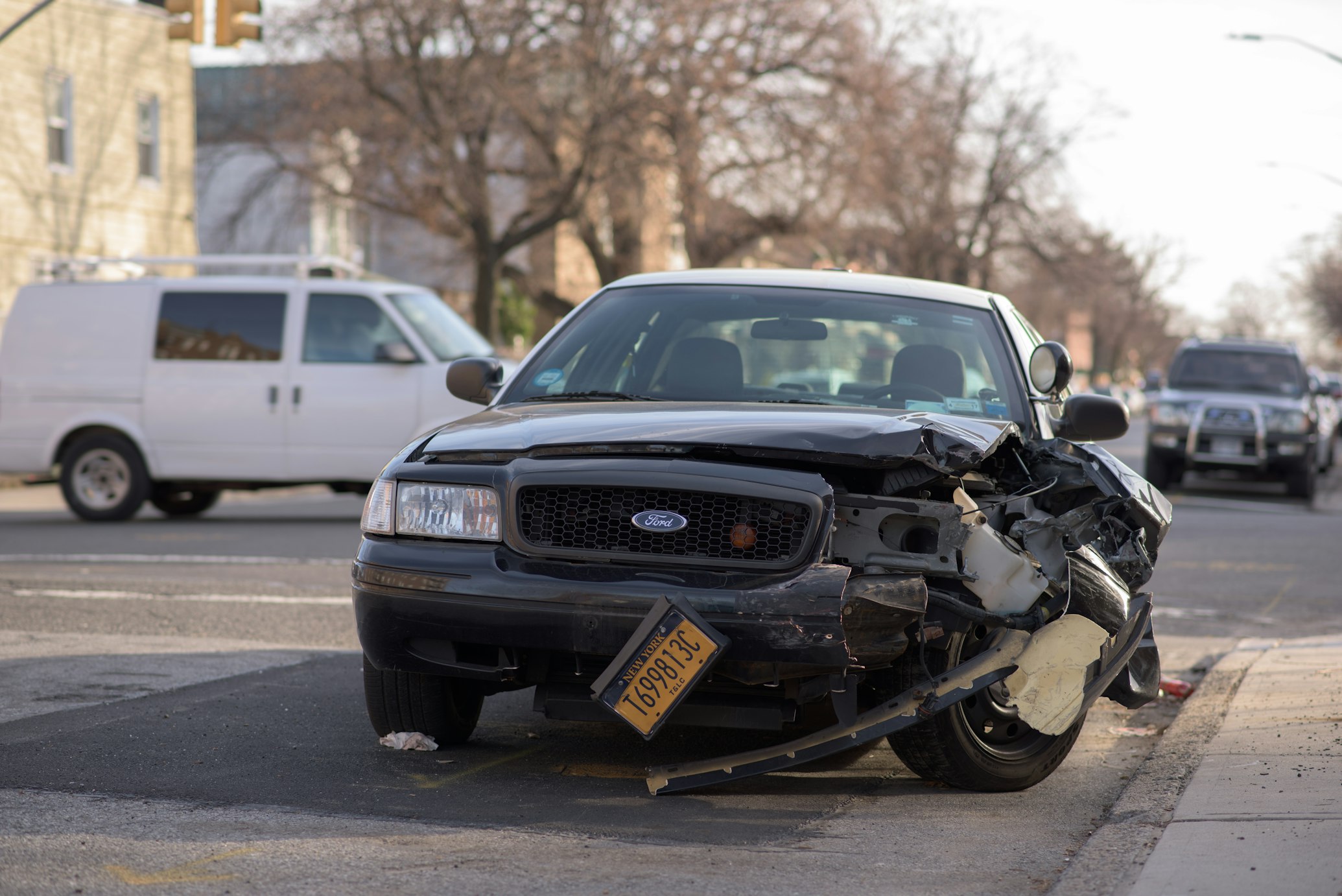 A car with a damaged front end.