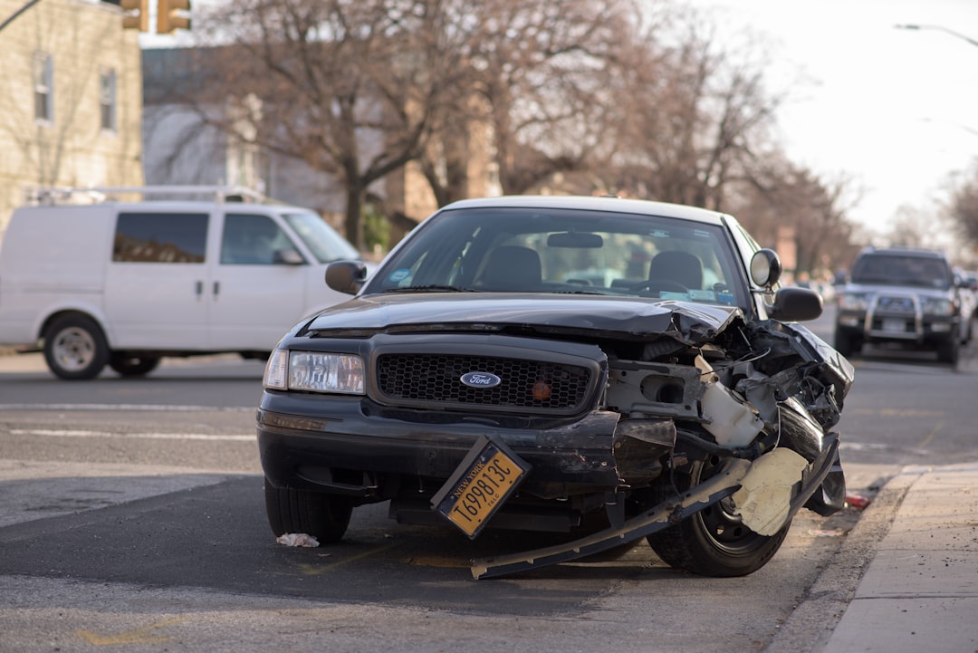 black Ford car, Taxi car damaged in a crash.