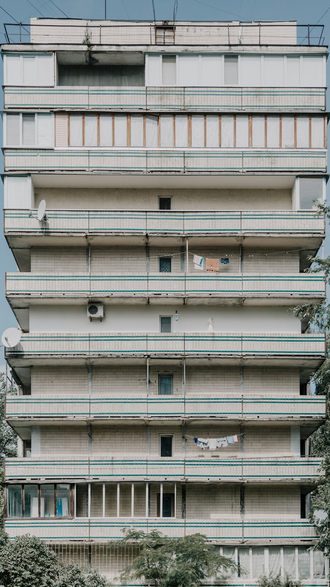 white and green concrete high-rise building