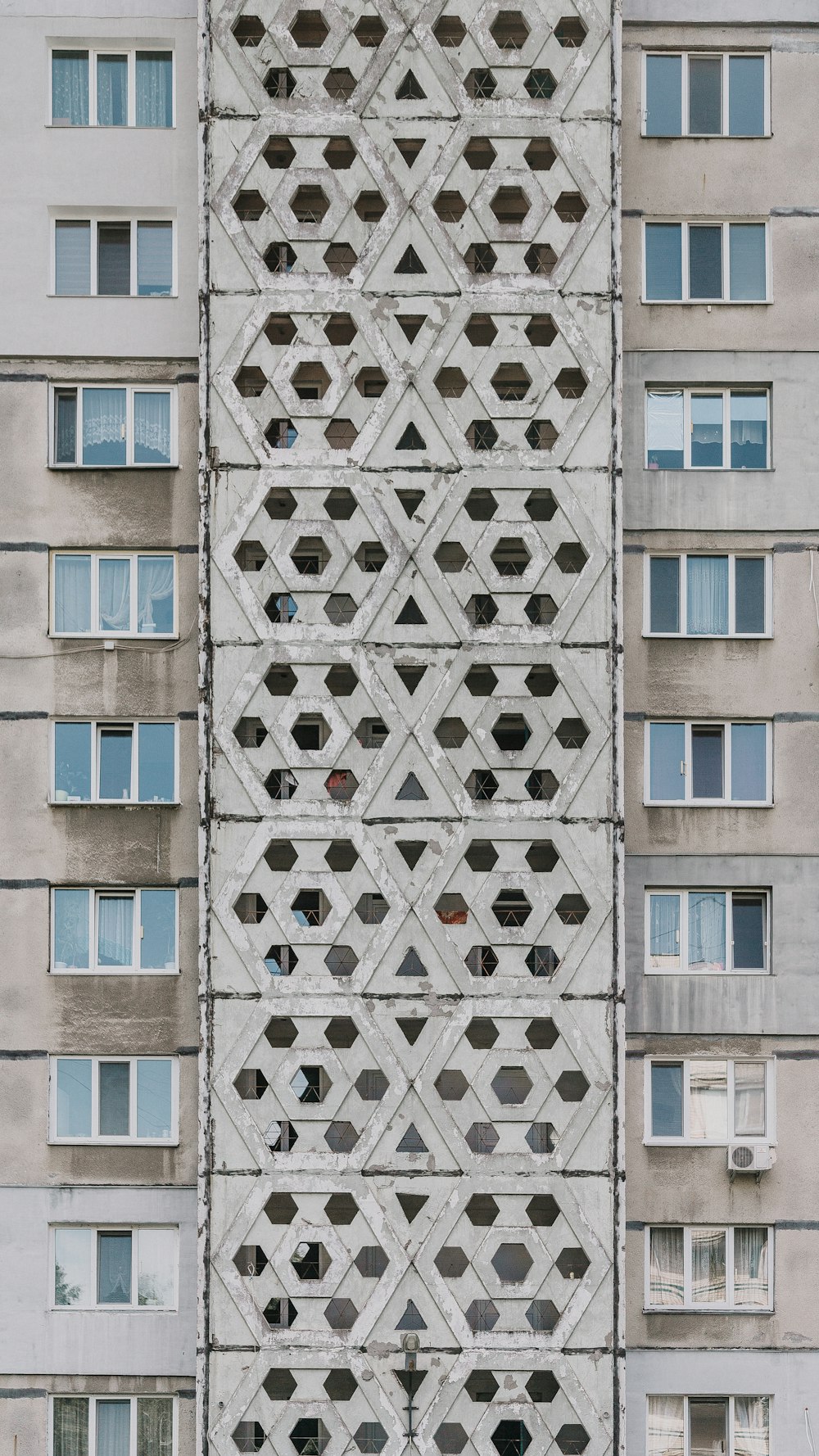 beige concrete high-rise building