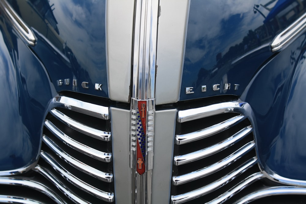 a close up of the front end of a classic car