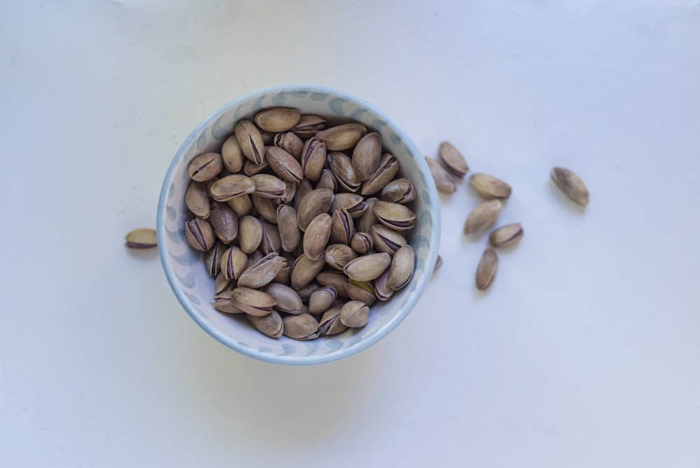 brown nuts in ceramic cup