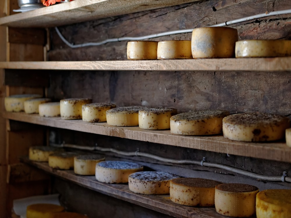round cheeses on rack