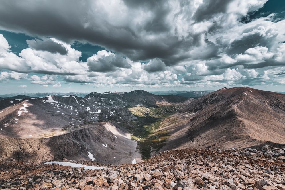 mountain under clouded sky