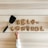 Cookies arranged to spell 'self control' rest on a wooden surface. A spatula is placed nearby, and a child's hand reaches towards the cookies.