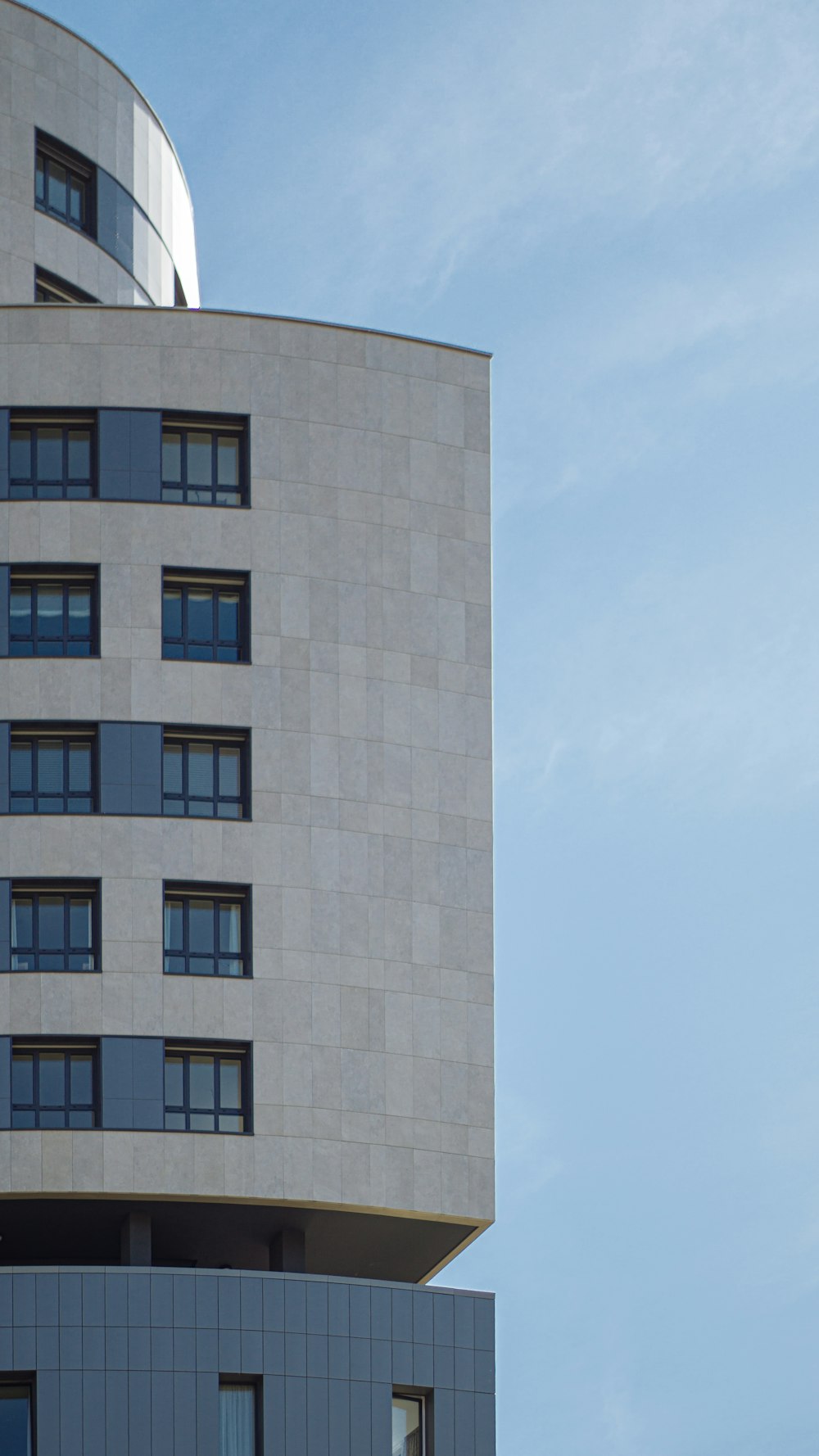 white and blue concrete building at daytime close-up photography