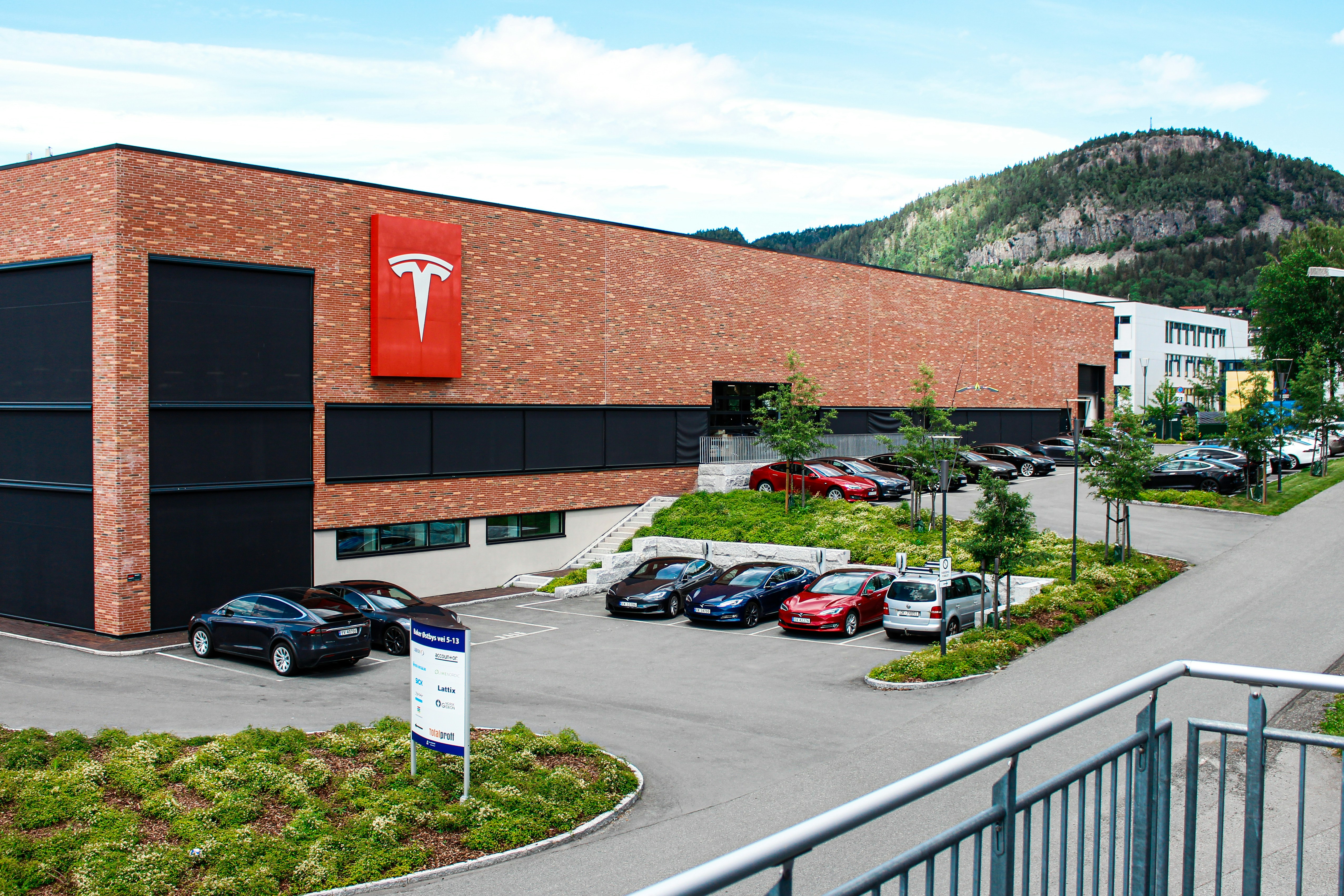 cars parked beside building during daytime