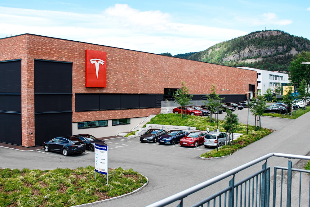 cars parked beside building during daytime