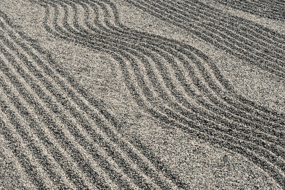 a sandy area with lines drawn in the sand
