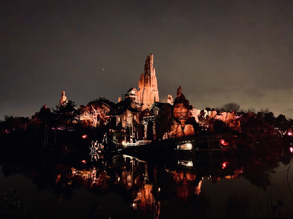 houses near mountain during night time