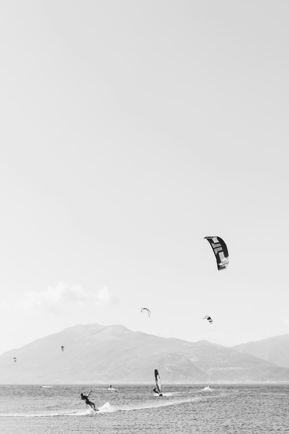 person kiteboarding during day