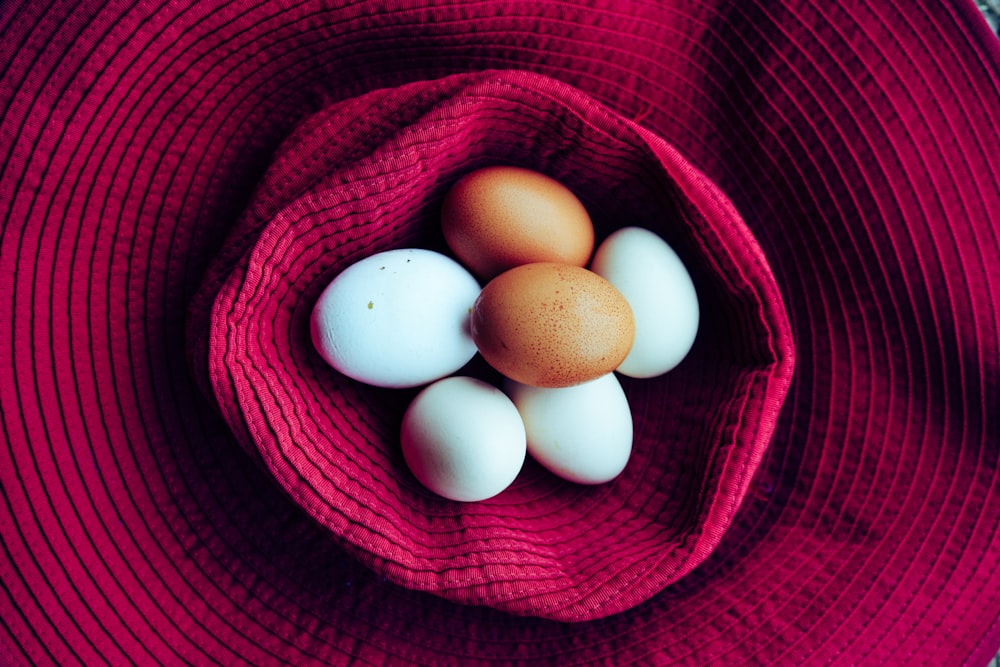 poultry eggs on sun hat