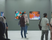 group of people inside museum painting