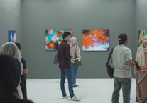 group of people inside museum painting