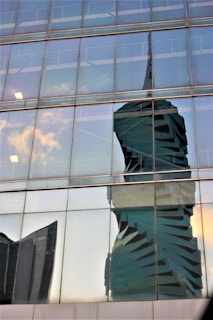 Night view of the Helix Collection’s architectural silhouette glowing softly under warm ambient lighting.