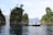 Image of a group of tourists kayaking near limestone cliffs at James Bond Island.