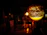 Close-up of a glowing resin lamp casting warm light in a cozy living room.