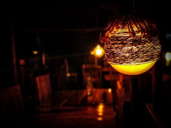 A beautifully crafted artisan lamp illuminating a cozy living space.