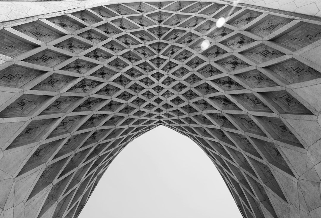 low angle photo of gray concrete ceiling