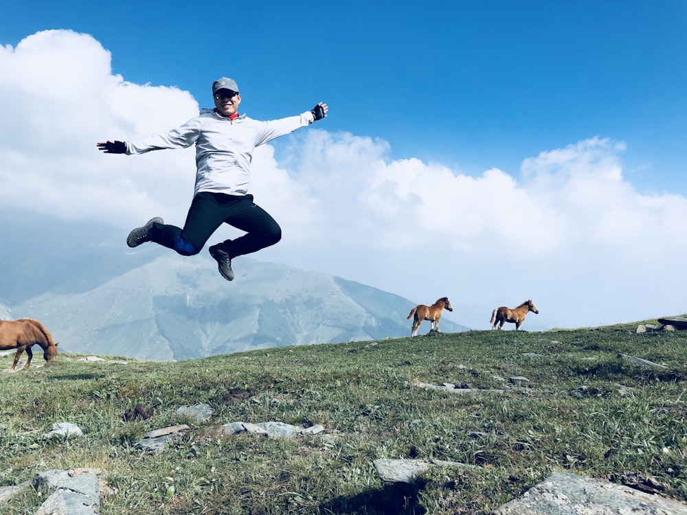 man jumping during daytime