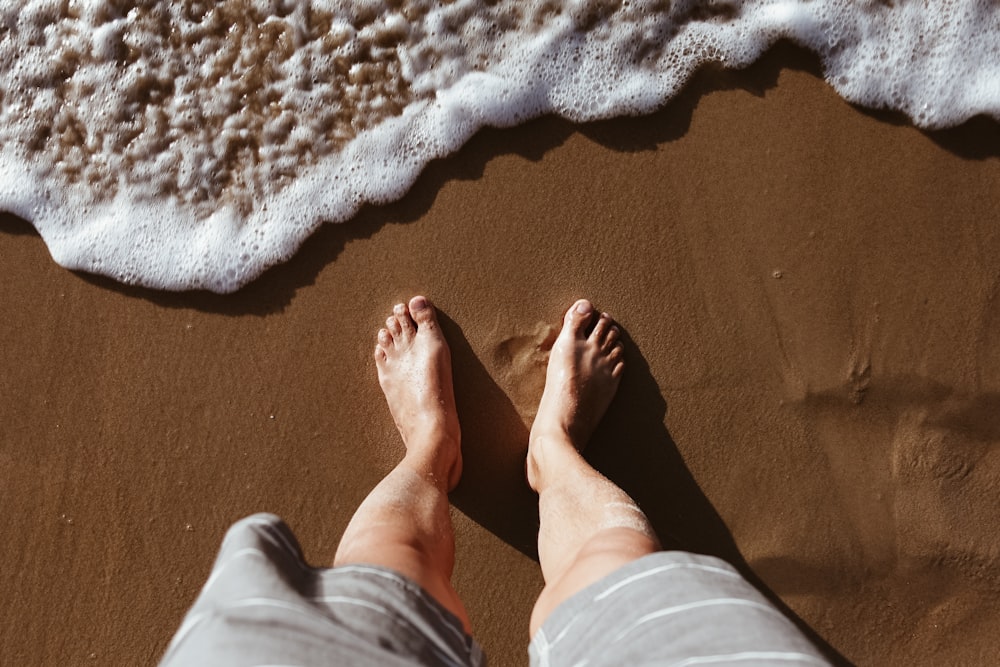 man standing on seashore