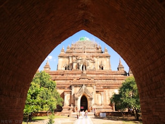 brown concrete building under blue sky at daytime