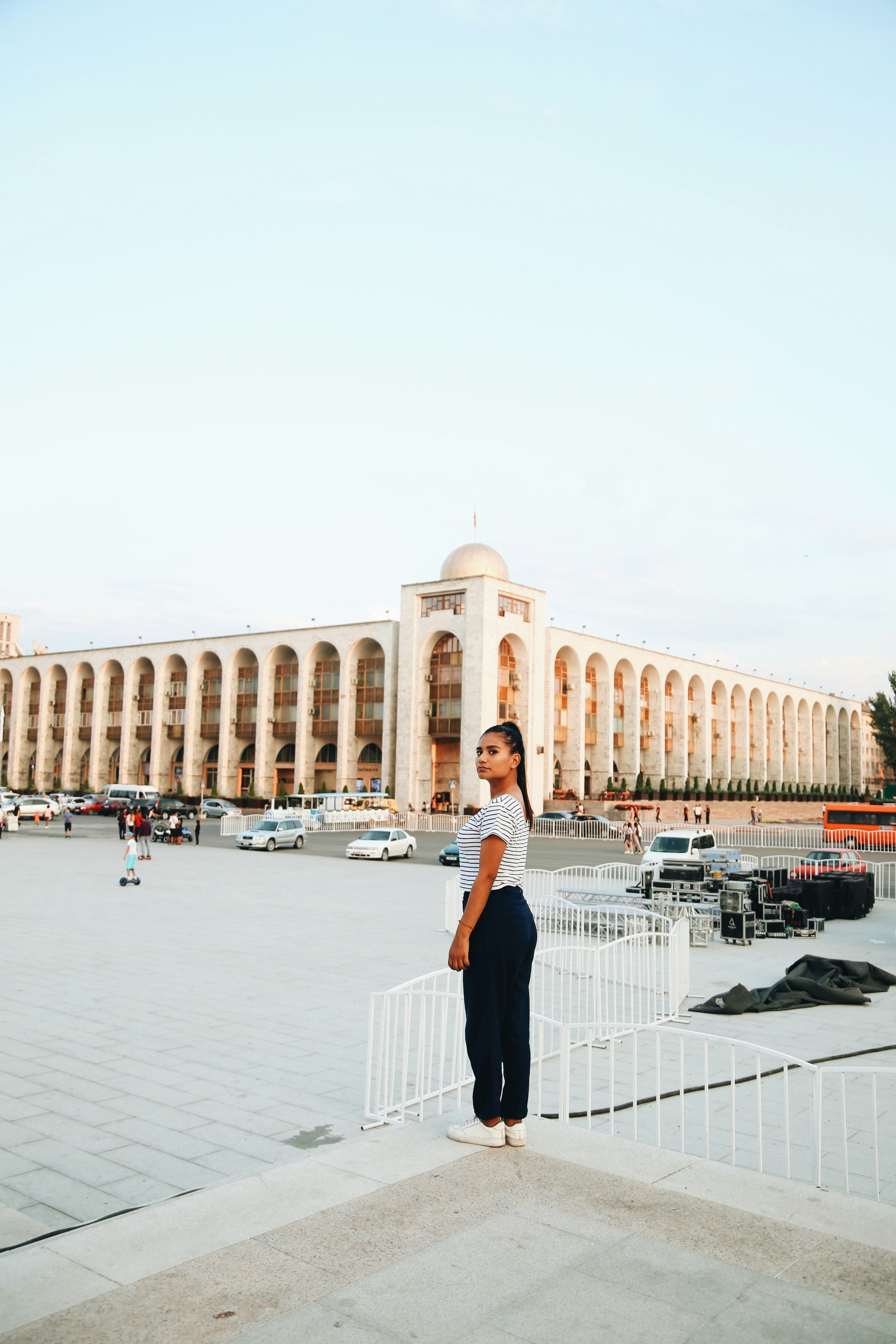 woman standing front of concrete building at daytime