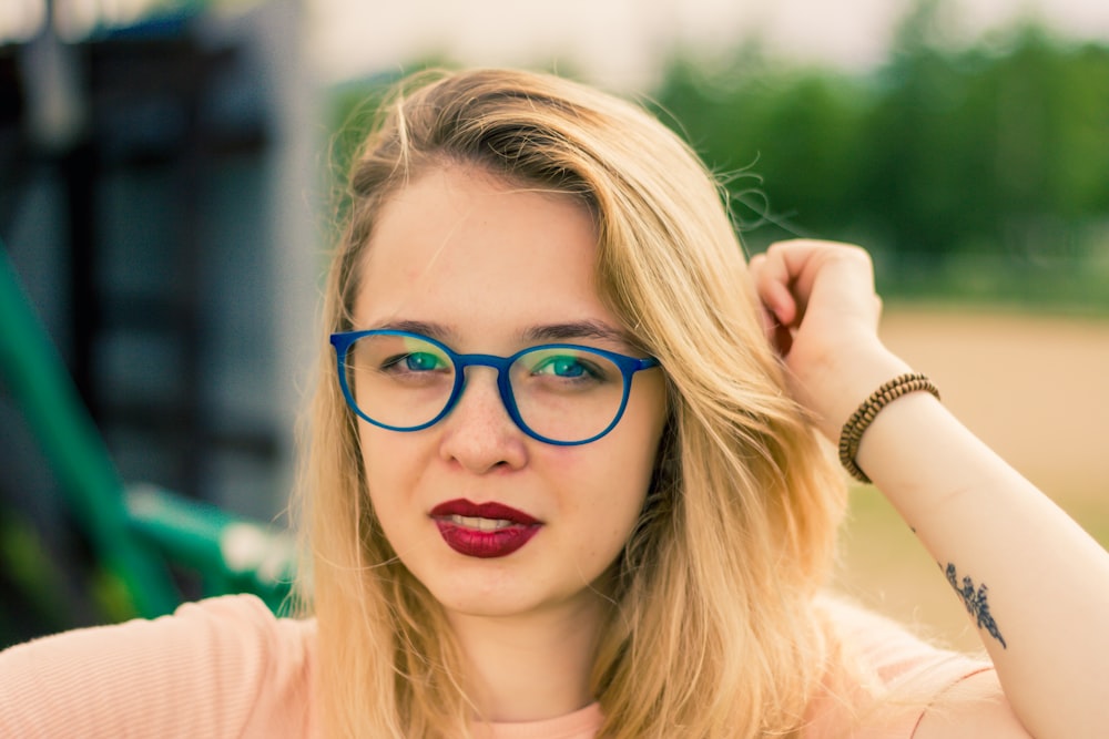 woman in blue-framed eyeglasses