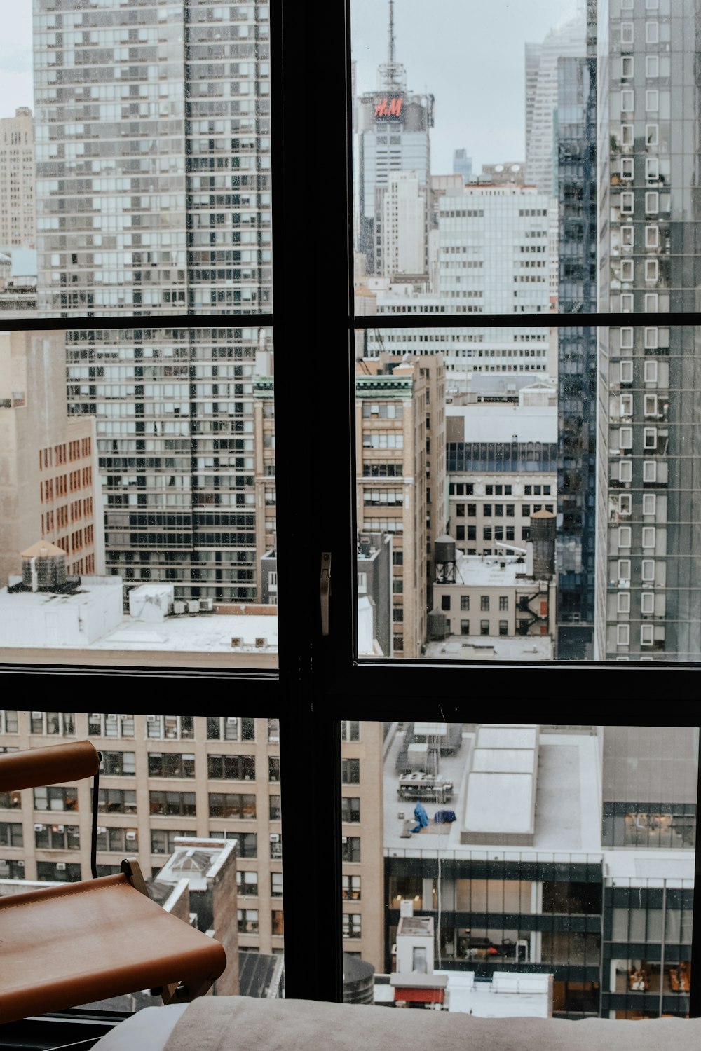 a view of a city from a bedroom window