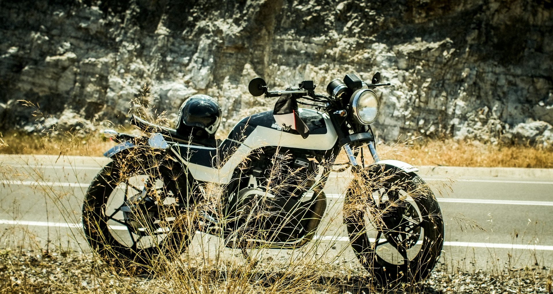 a motorcycle parked on the side of the road
