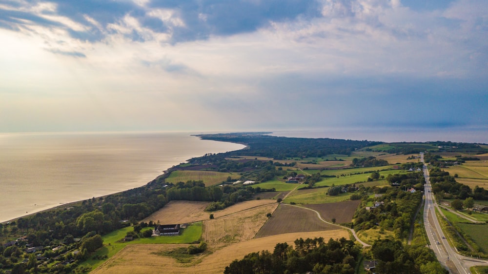 top view of plaid field and ocean