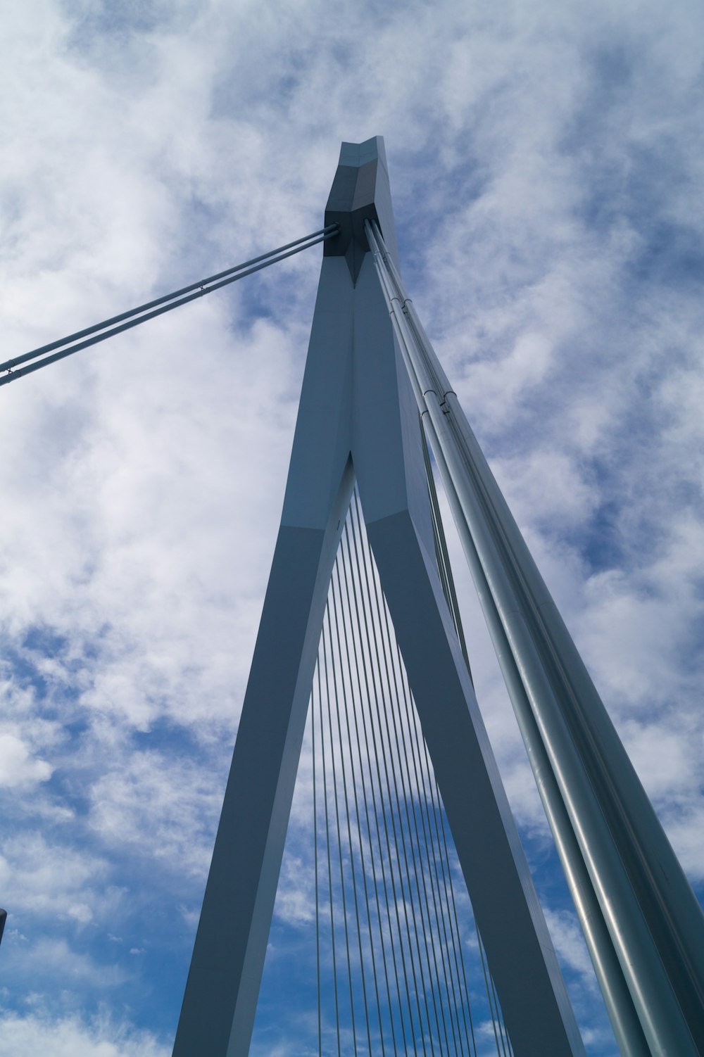 a very tall bridge with a sky background