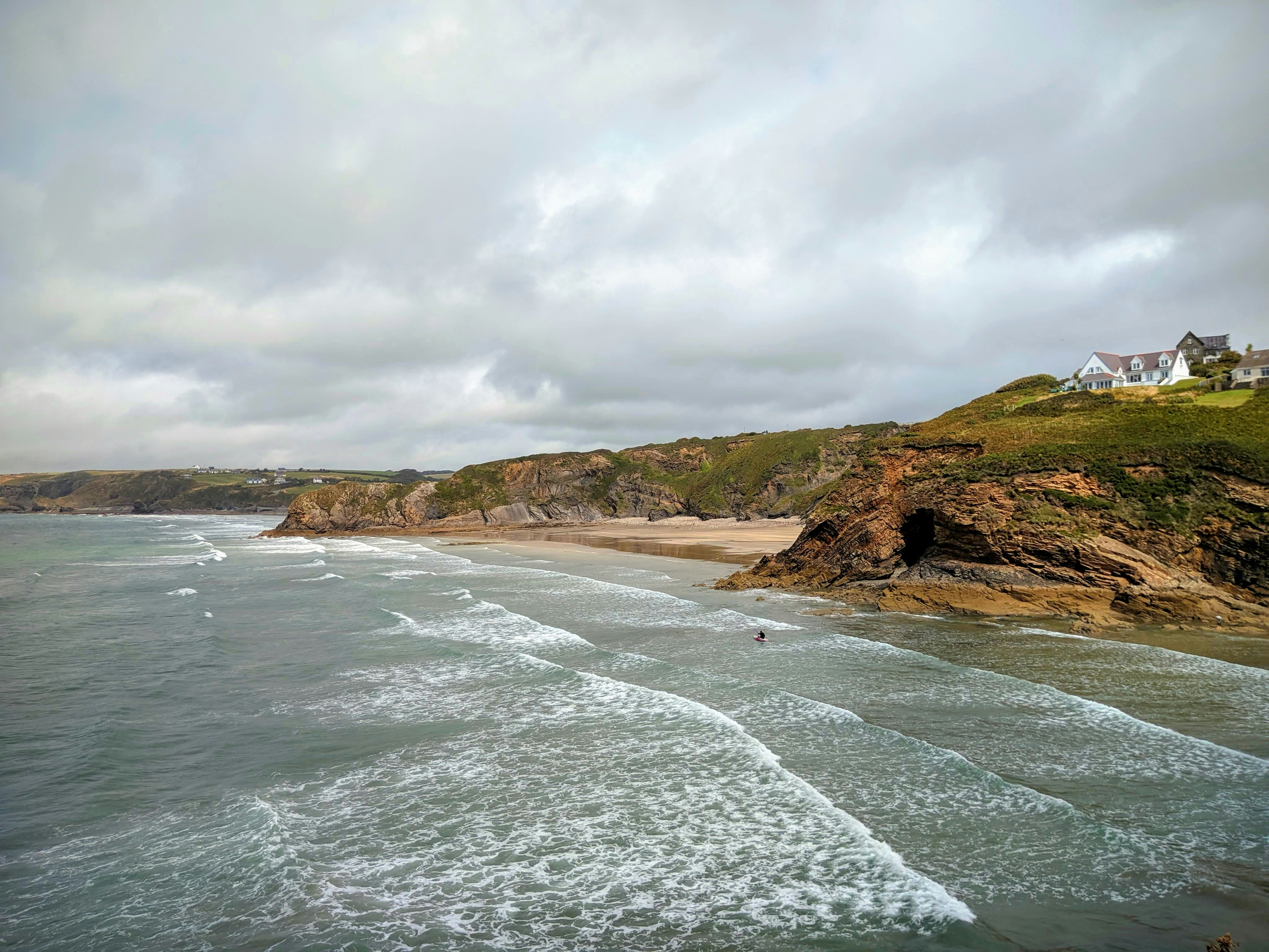 brown cliffs by a beach landscape