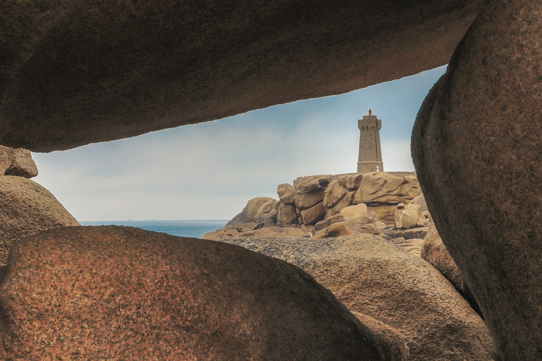 gray lighthouse under blue sky