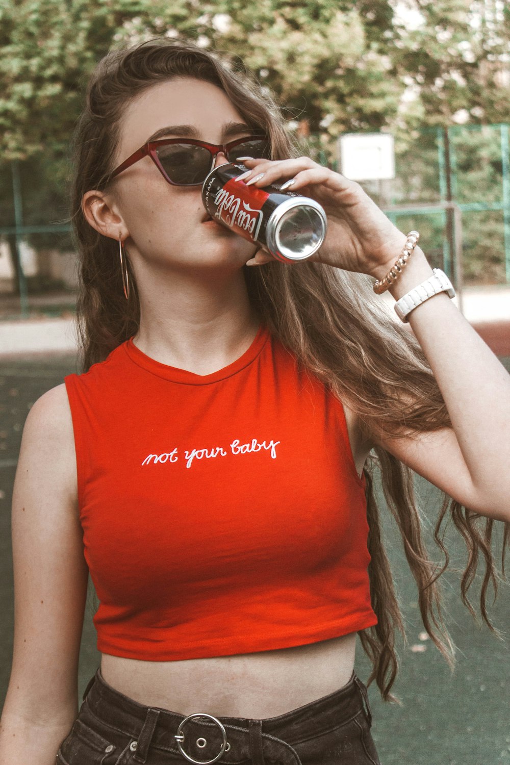 woman about to drink Coca-Cola soda