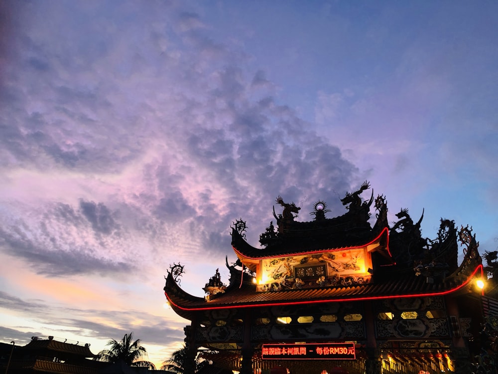 black and red temple under gray skies