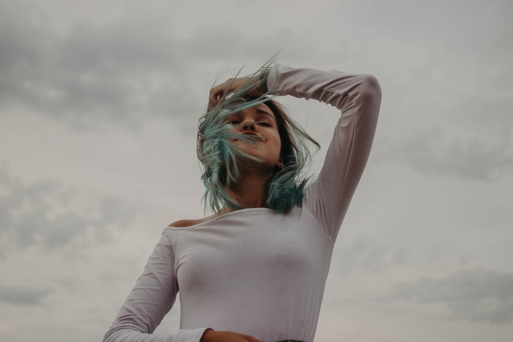 woman in white long sleeve shirt