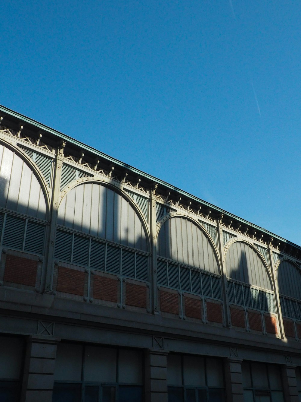 gray building under blue sky