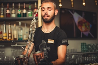 man bartering inside bar