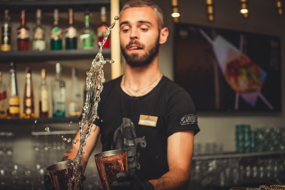 man bartering inside bar