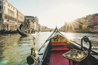 A romantic gondola ride through the canals of Venice at twilight.