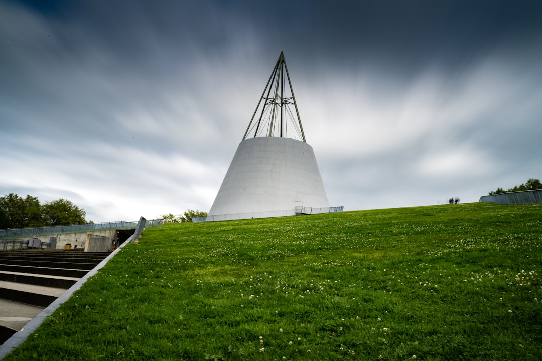 white concrete tower on green grass