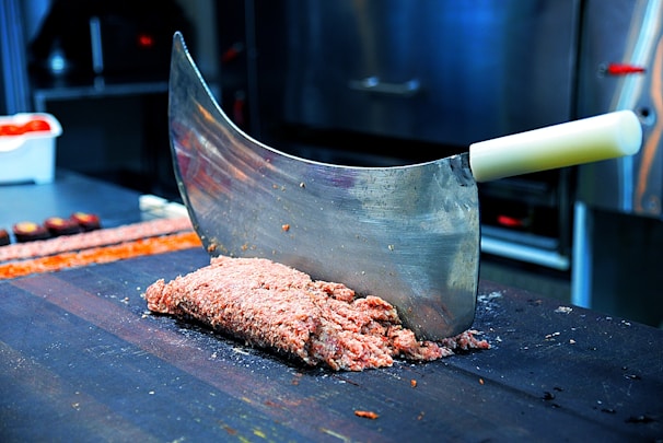 A robust bone saw designed for efficient processing in a food production setting.