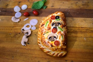 Golden calzones with a chewy crust, oozing with melted cheese and savory fillings