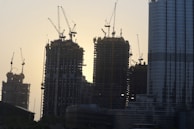 Urban skyline featuring completed civil engineering projects at sunset.