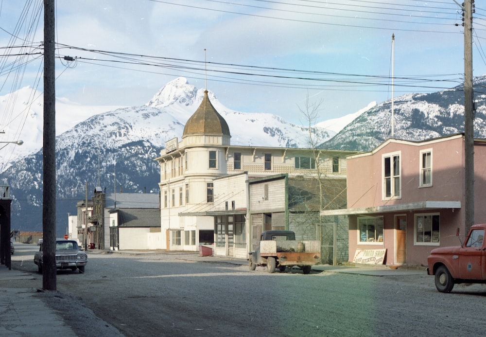 vehicles on road near buildings during daytime