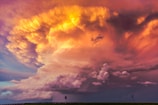 plume of orange clouds at sunset