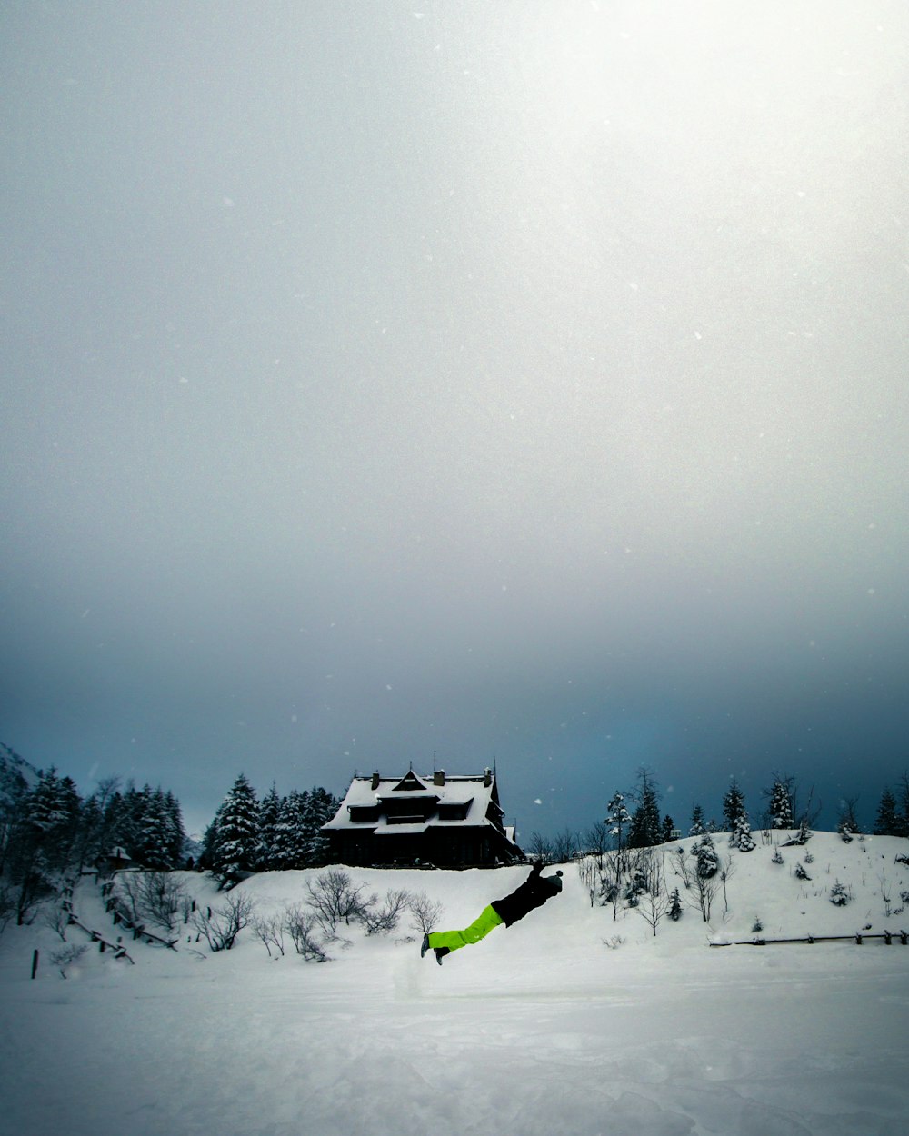 snow-covered field and house