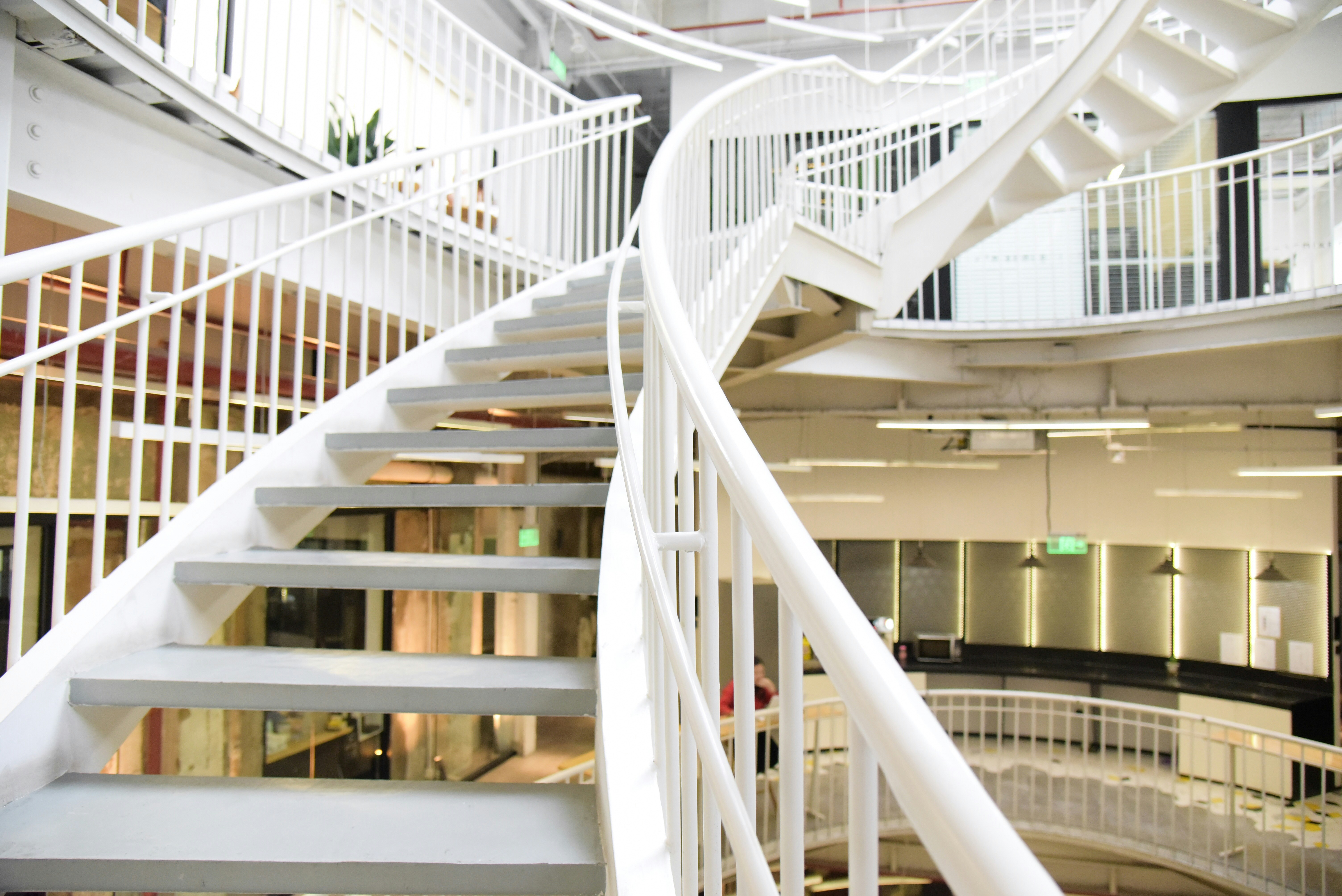 white and grey concrete staircase inside building